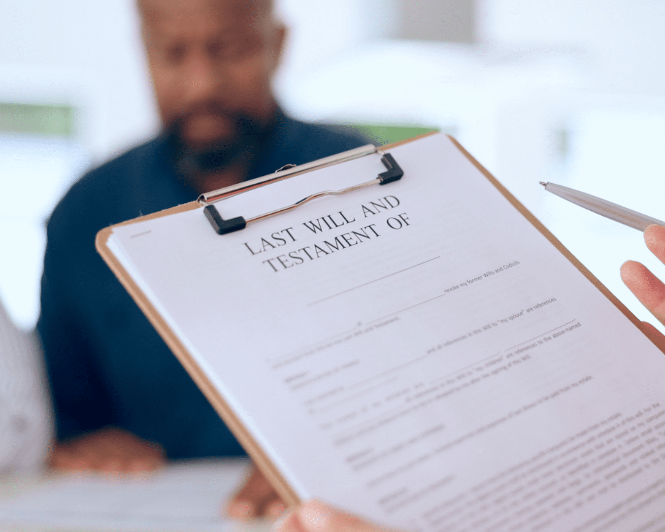 Close-up shot of person reviewing Last Will and Testament.